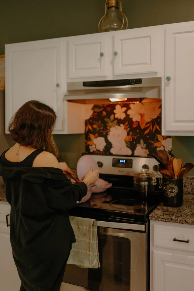 how to make a house feel like a home woman wearing all black in kitchen
